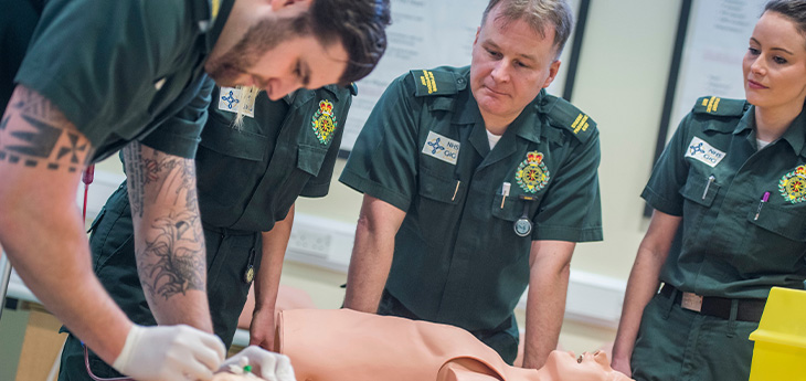 Paramedics practicing clinical skills 